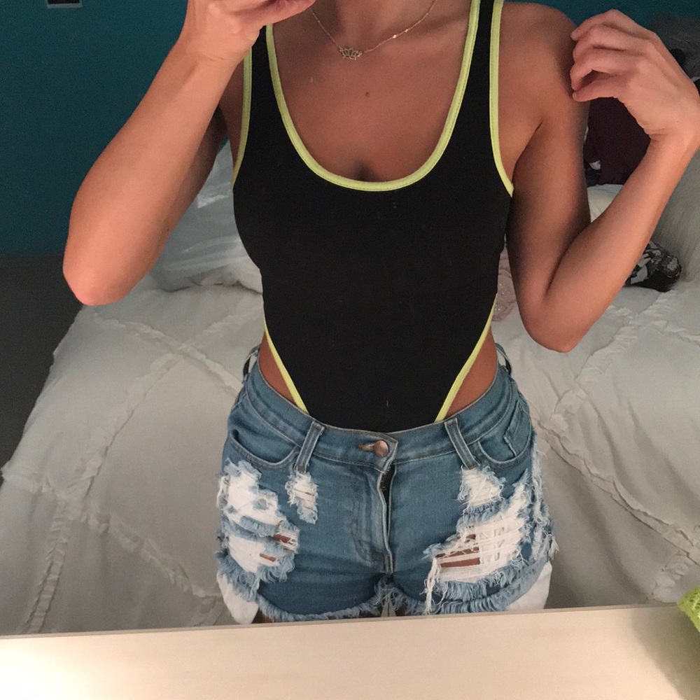 Black and neon yellow trim bodysuit